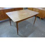 A Danish teak extending dining table