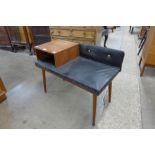 A teak and black vinyl hall seat