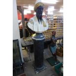 A painted plaster bust of an Arabic man, on pedestal