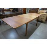 A McIntosh teak T3 extending dining table