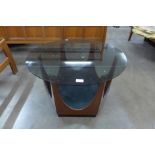 A G-Plan teak and glass topped circular coffee table