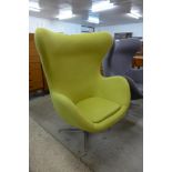 An Arne Jacobsen style chrome and lime green fabric revolving egg chair