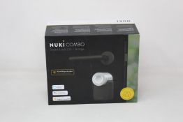 A boxed as new Nuki Combo Smart lock 2.0 + Bridge (Compatible with UK sockets).