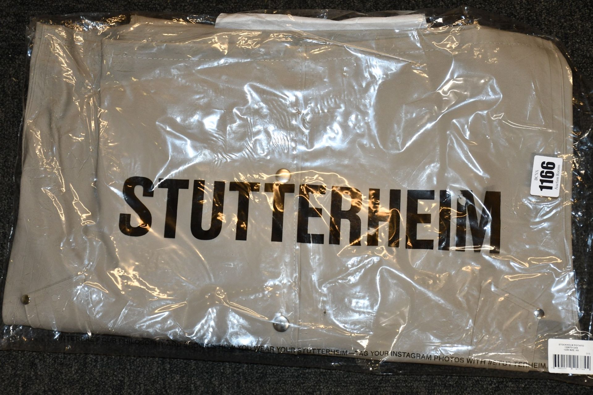 An as new Stutterheim Stockholm coat (XS).