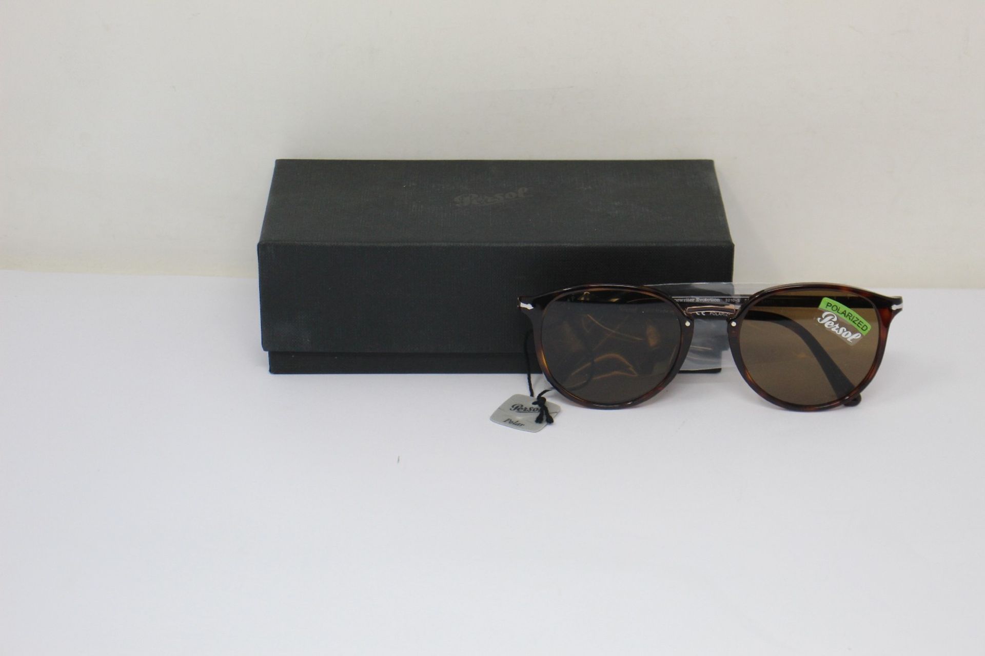 A pair of as new Persol sunglasses.