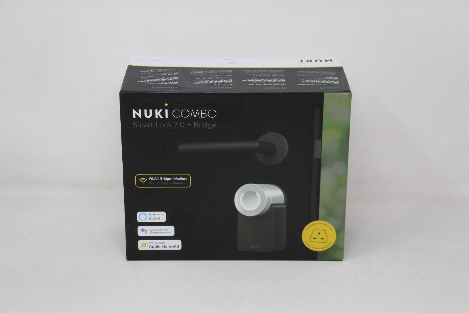 A boxed as new Nuki Combo Smart lock 2.0 + Bridge (Compatible with UK sockets).