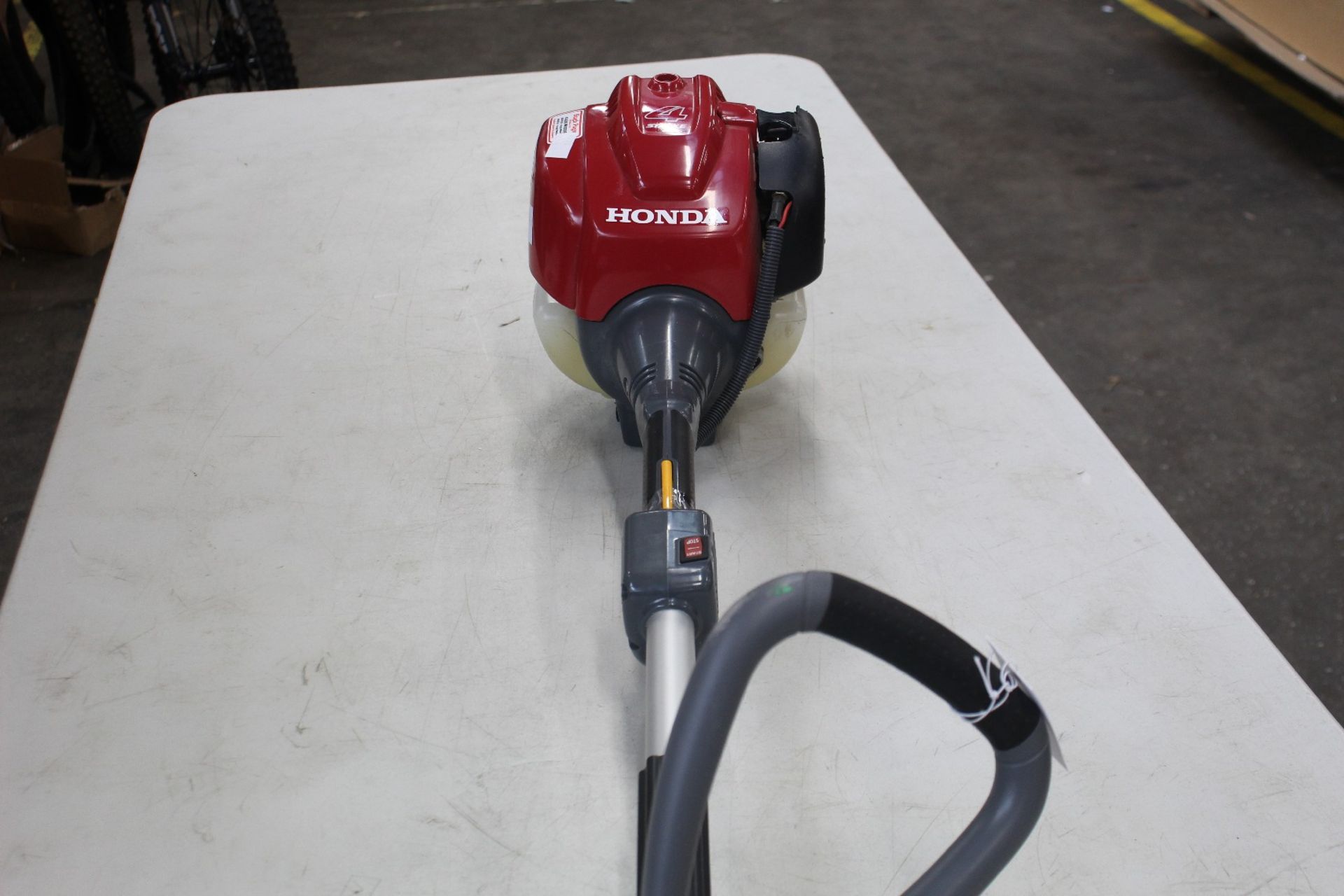 A pre-owned Honda GX25 - 4 Stroke Petrol Strimmer.