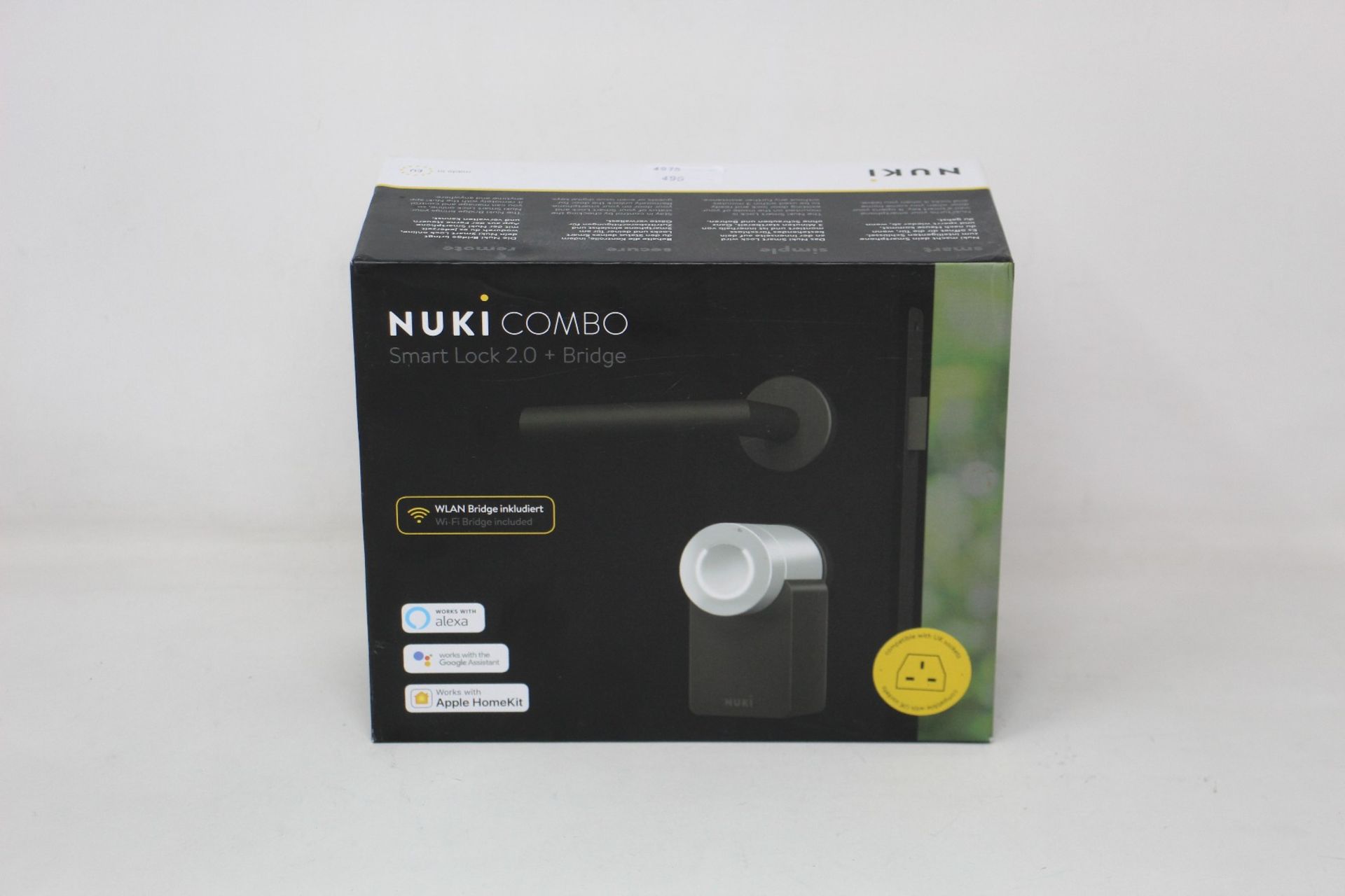 A boxed as new Nuki Combo Smart lock 2.0 + Bridge (Compatible with UK sockets).