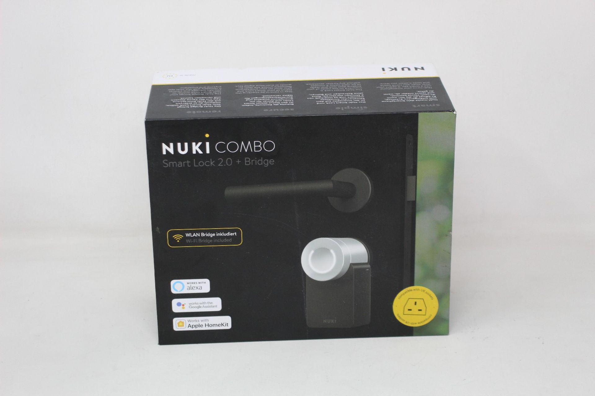 A boxed as new Nuki Combo Smart lock 2.0 + Bridge (Compatible with UK sockets).