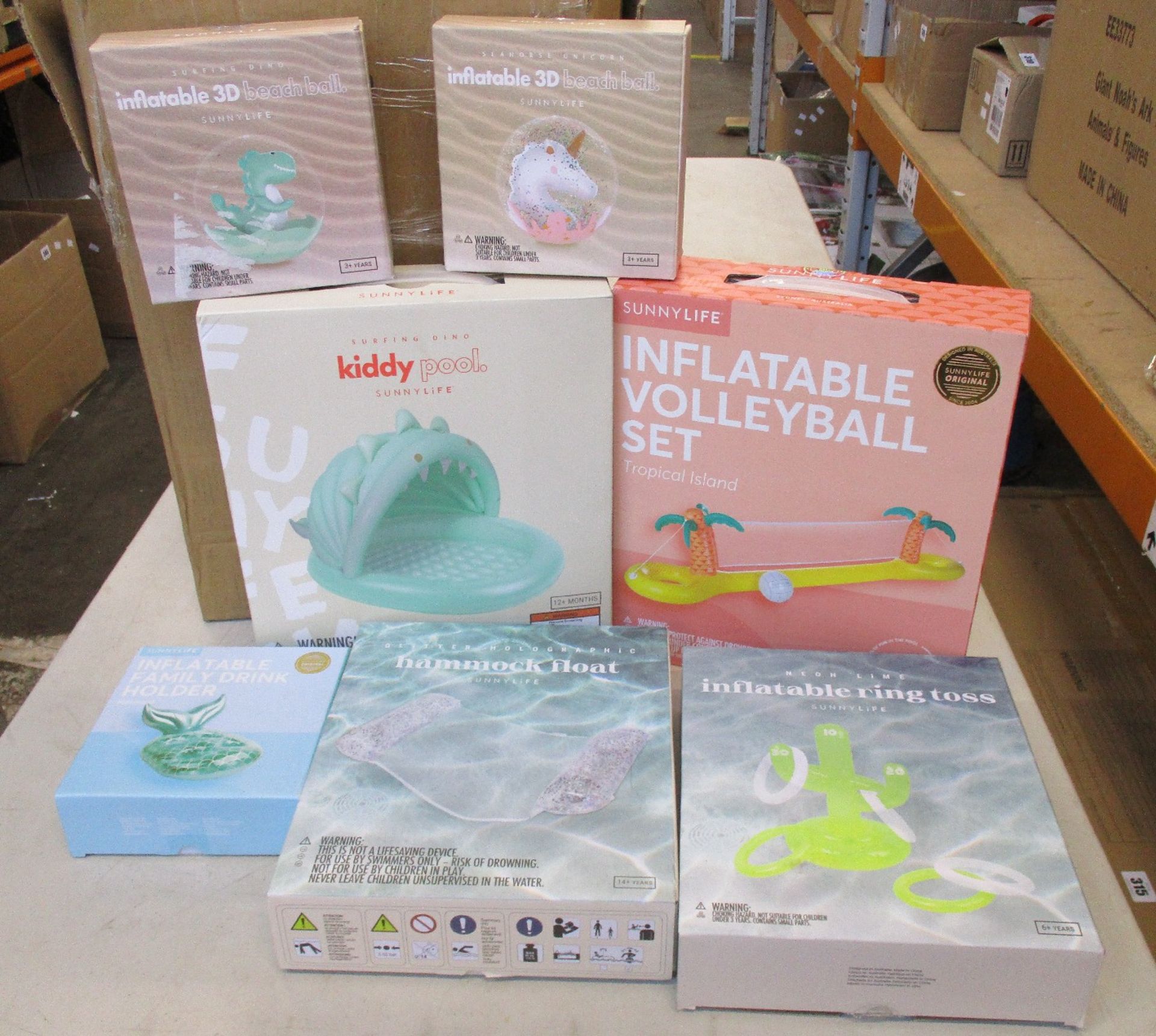 A quantity of as new SunnyLife pool floats and accessories to include a surfing dino, two children's