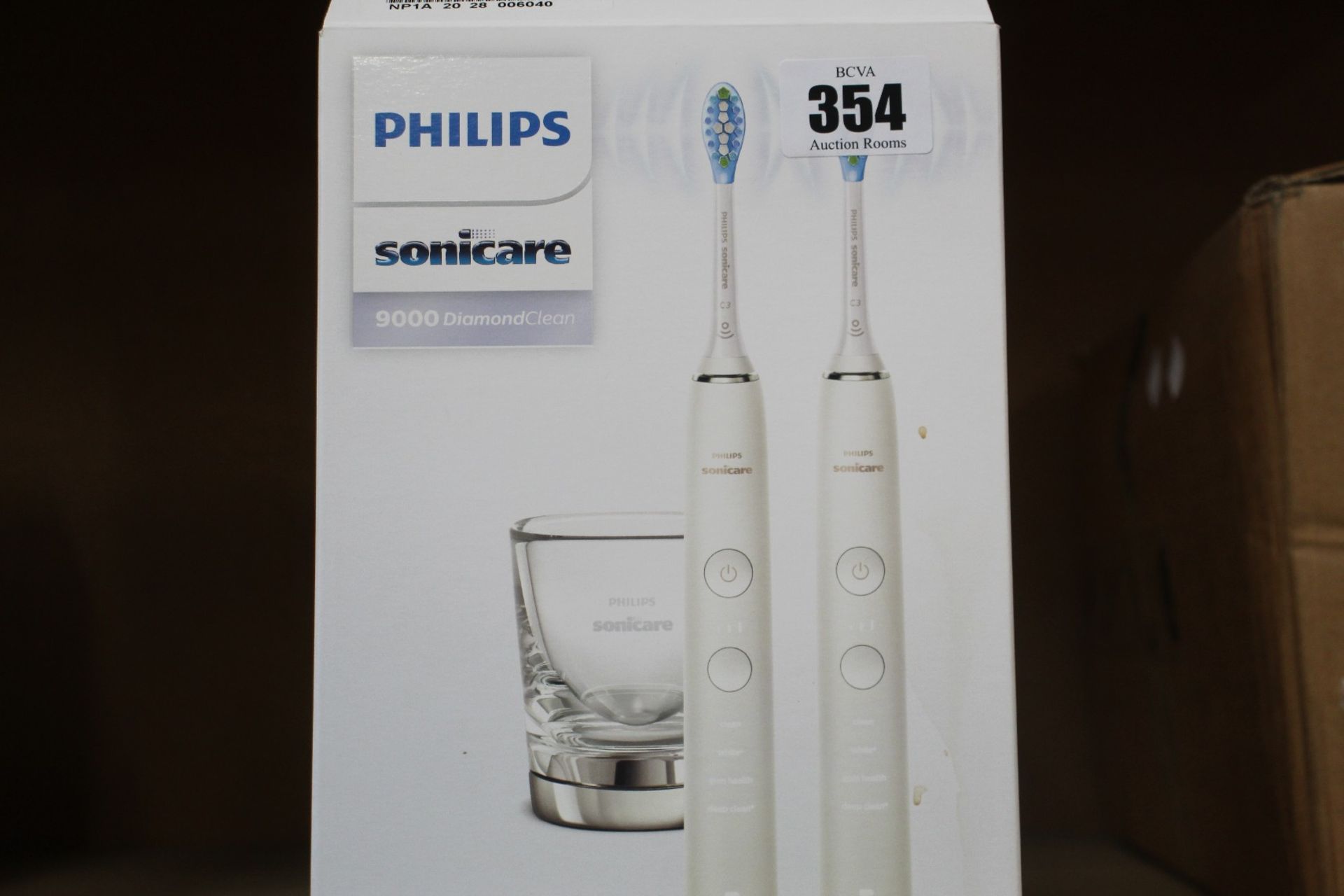 A Philips Sonicare DiamondClean 9000 Set of 2 White Electric Toothbrushes (Seal broken on box).