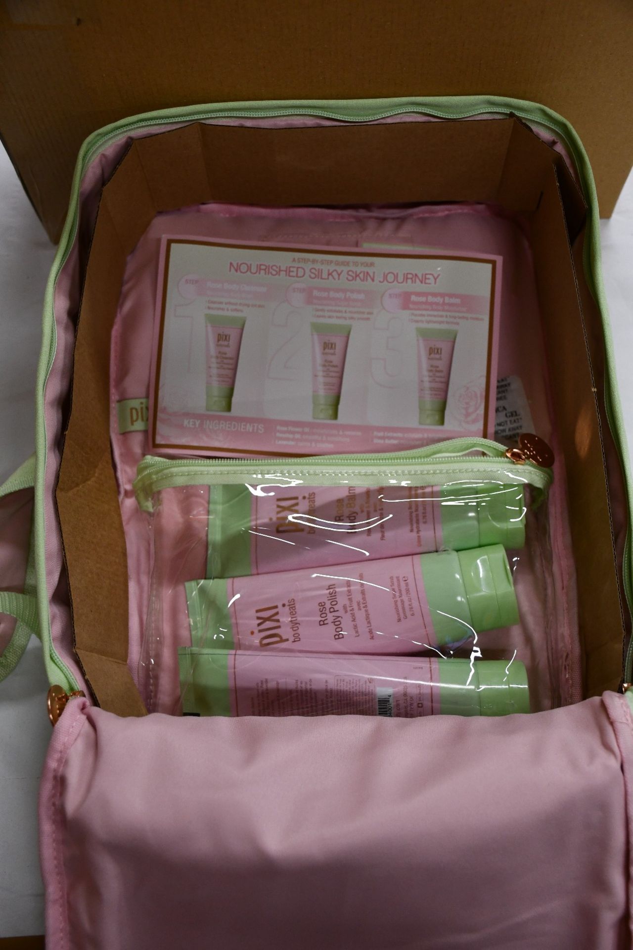 Seven Pixi back packs containing Rose body butter, Rose body polish, Rose body balm.