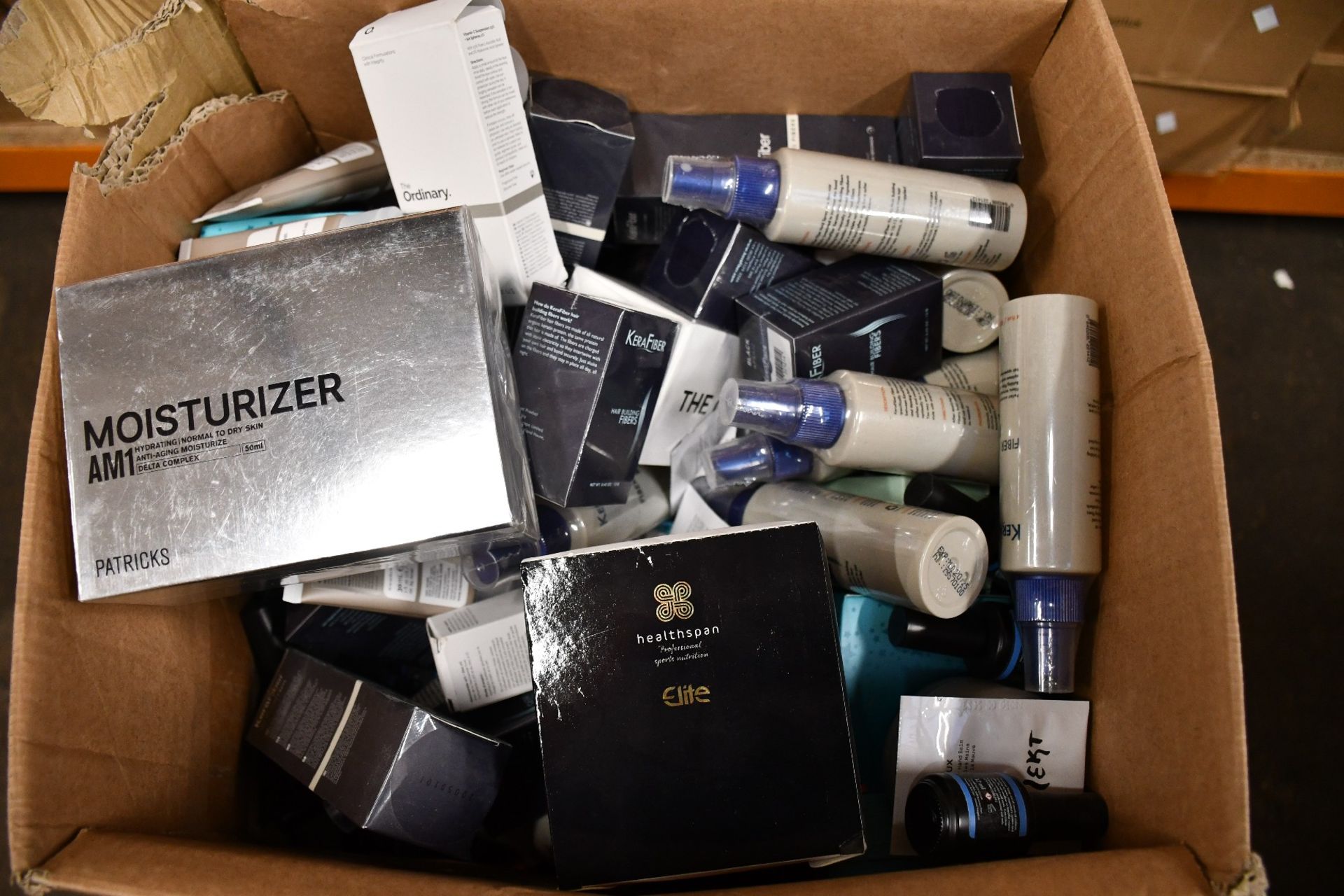 A box of luxury beauty items and luxury hair products.