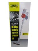 A new Zanussi Airwave Red cordless rechargeable 130W, 1Ltr 3 in 1 hand stick vacuum cleaner (ZHS-