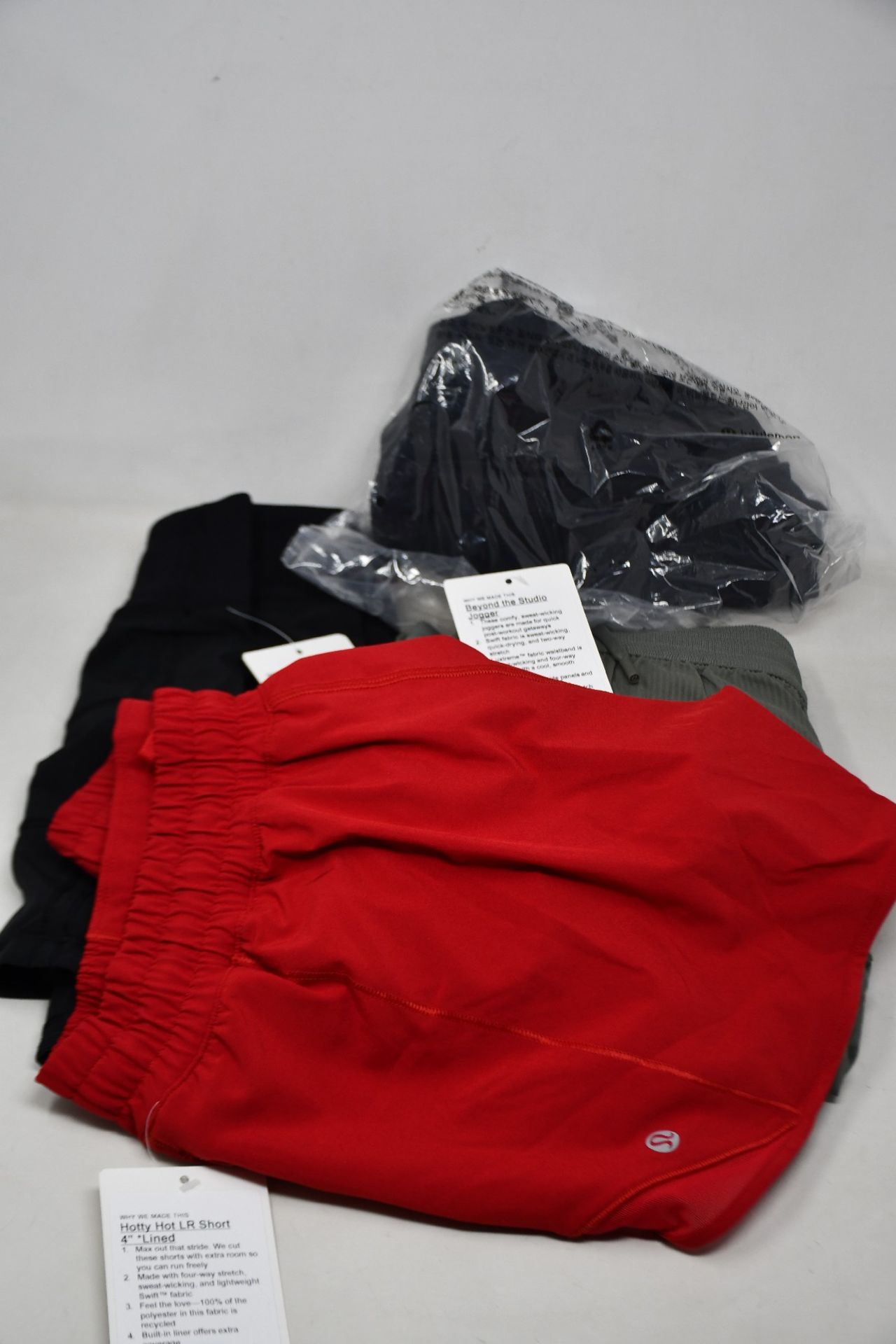 Four items of as new LuluLemon fitness wear; Beyond The Studio joggers (Size 8 - RRP £98), Pace