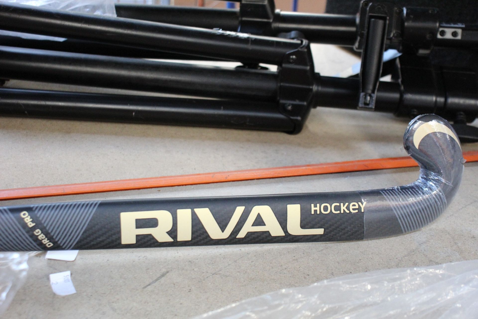 A Rival Drag Pro carbon fibre hockey stick (Some slight scuffs, viewing advised).