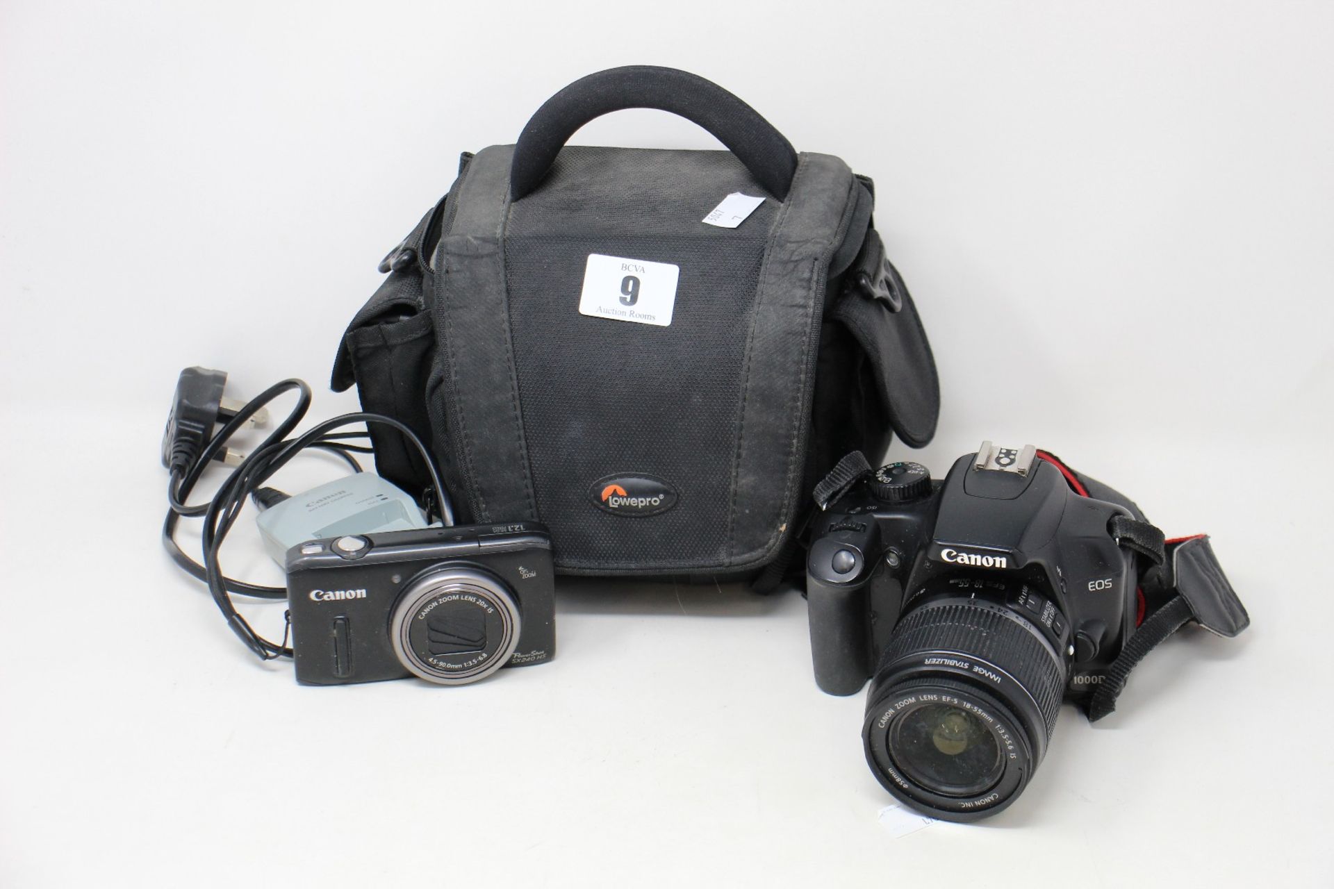 A pre owned Canon EOS 100d camera with charger and case and a Canon powershot sx240hs with charger.