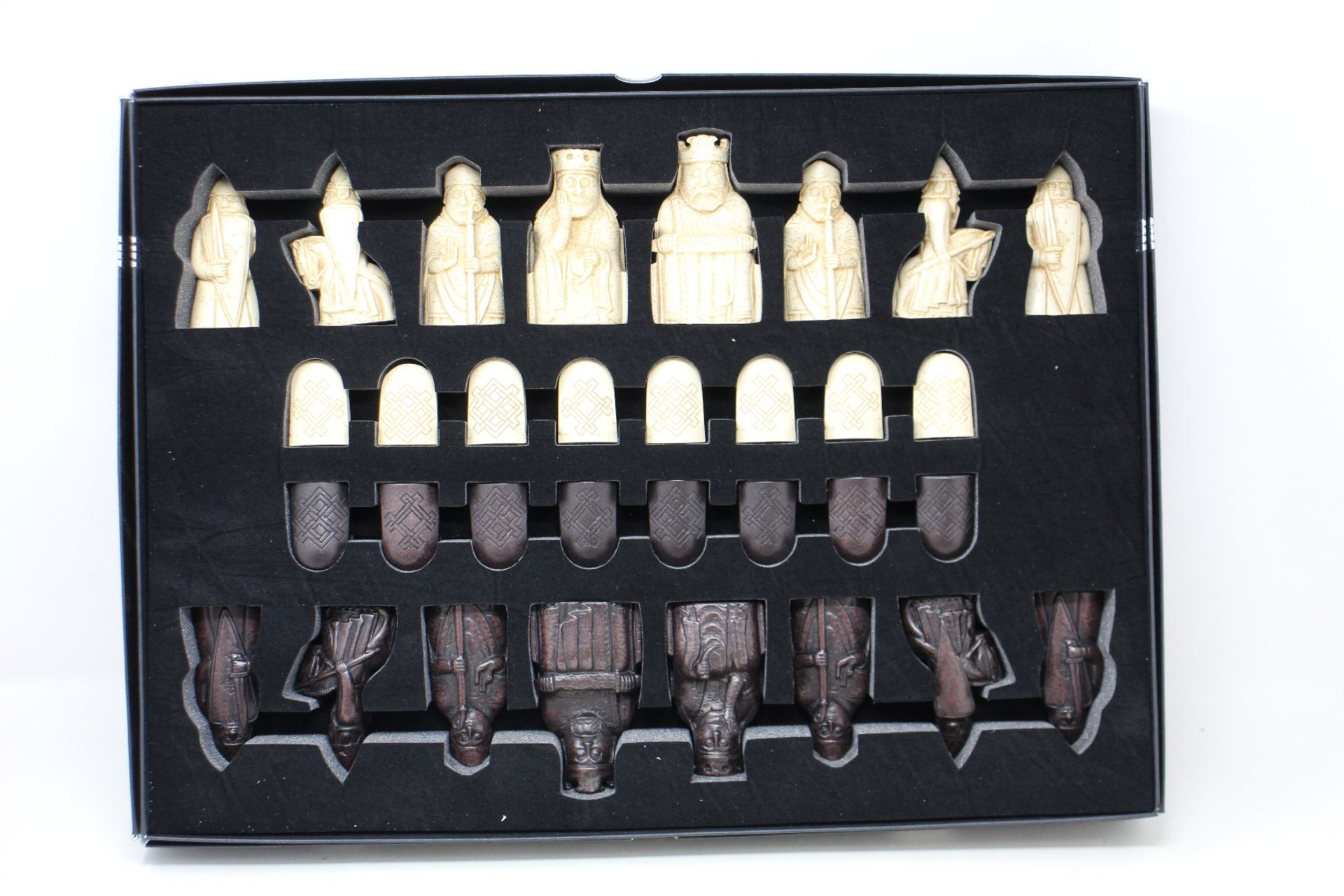 An as new The Lewis Chessmen chess set by National Museums Scotland.