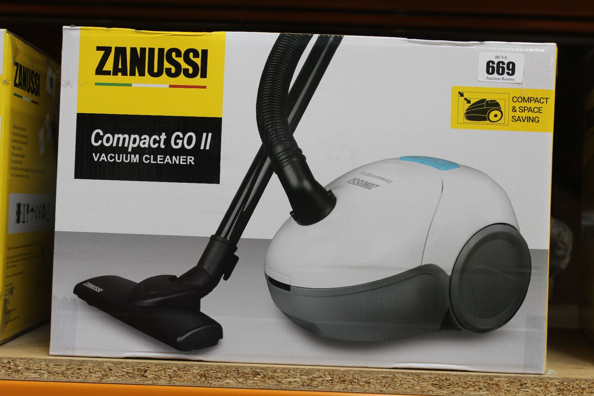 A new Zanussi Compact Go ll White, 750W, 1.5L, 5M automatic cord rewind vacuum cleaner.