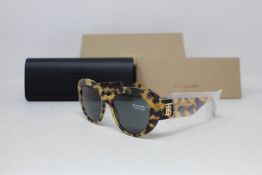 A pair of as new Burberry sunglasses.