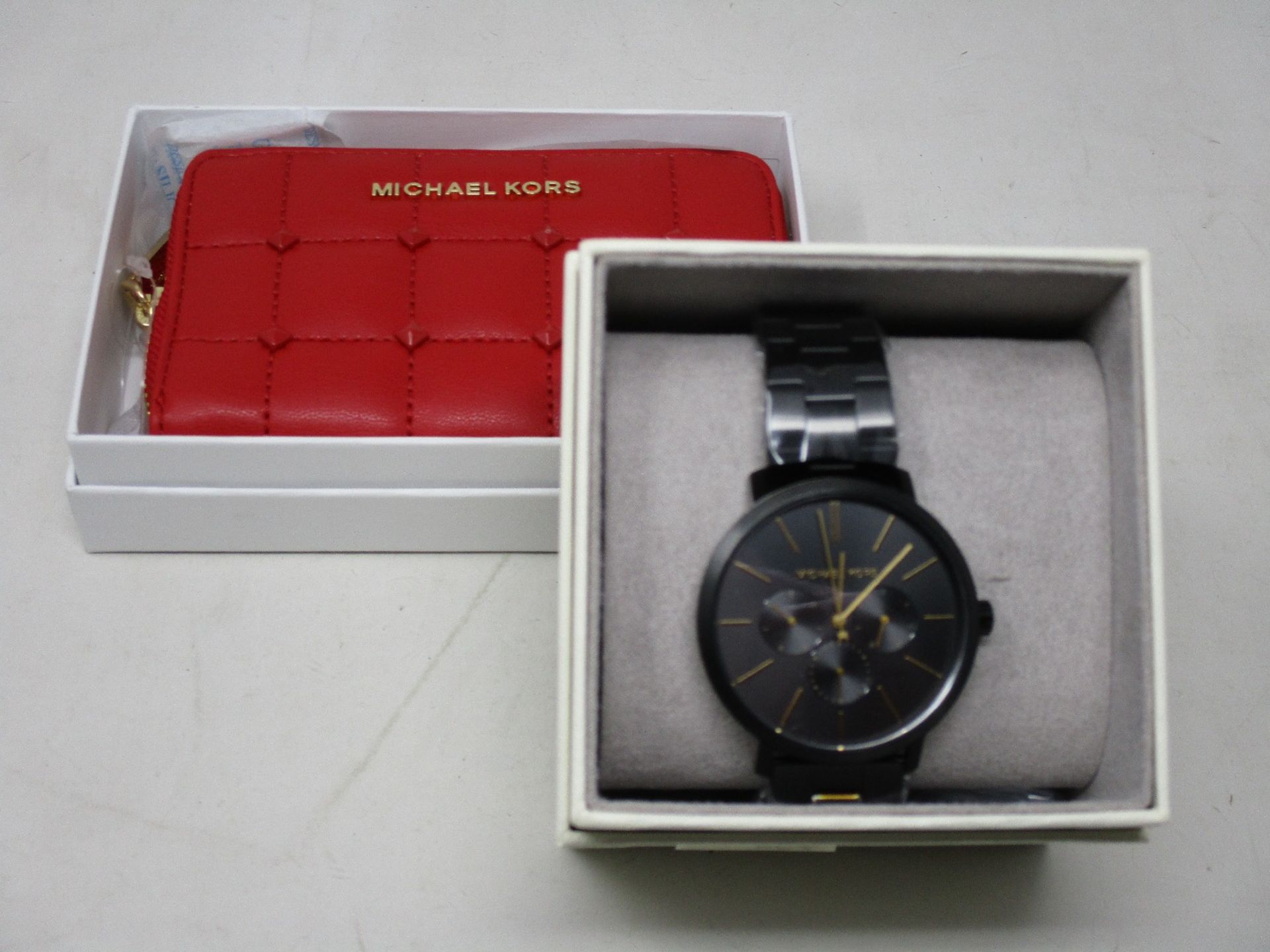 An as new Michael Kors MK8703 watch and a Jet Set purse in red.