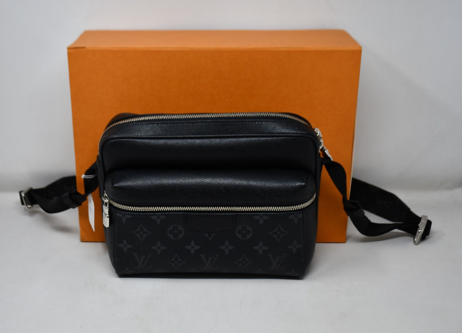An as new Louis Vuitton Outdoor Messenger bag in black (RRP £1550).