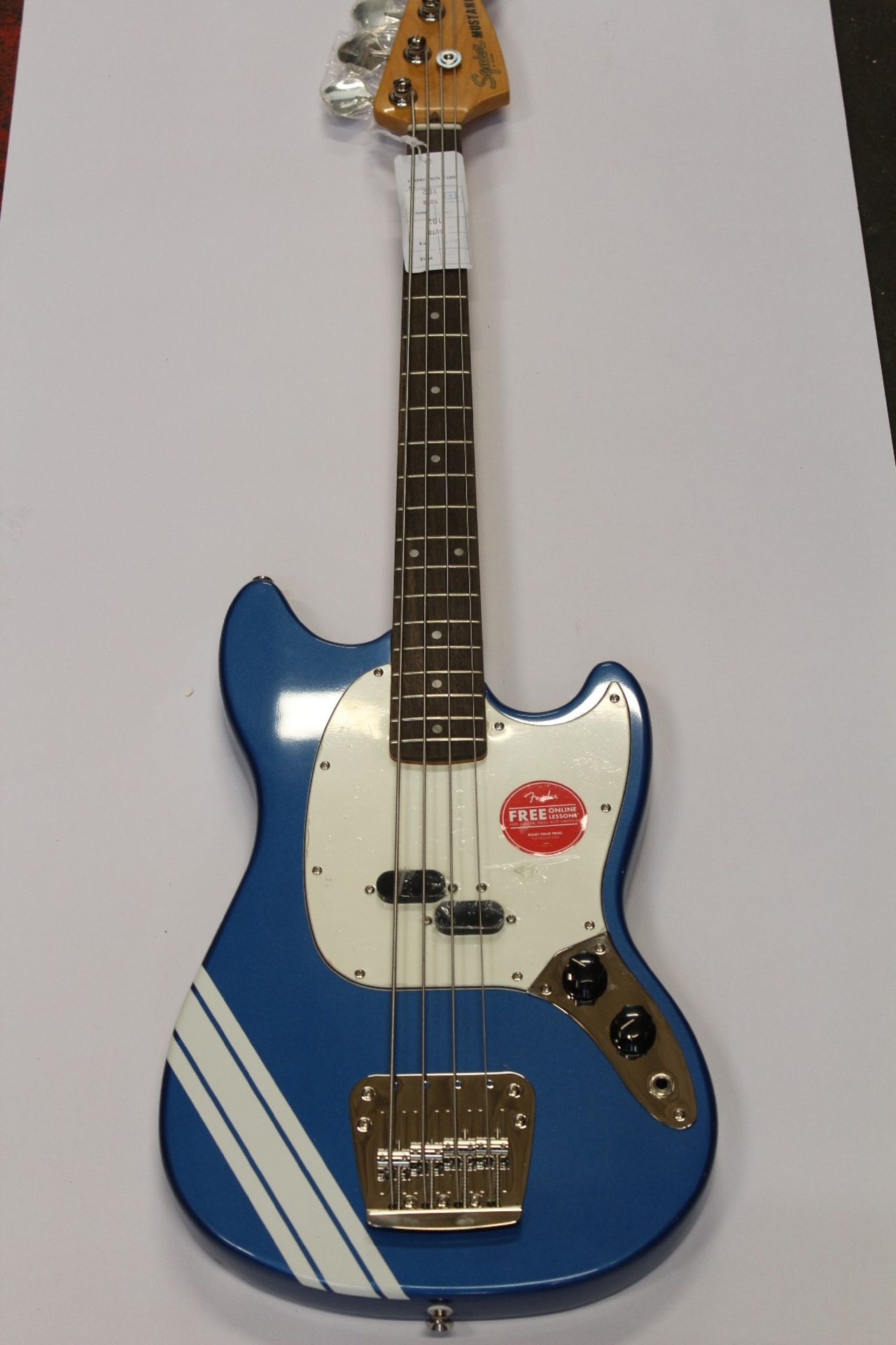 A Squier FSR Classic Vibe Mustang Bass in Lake Placid Blue with white stripes.