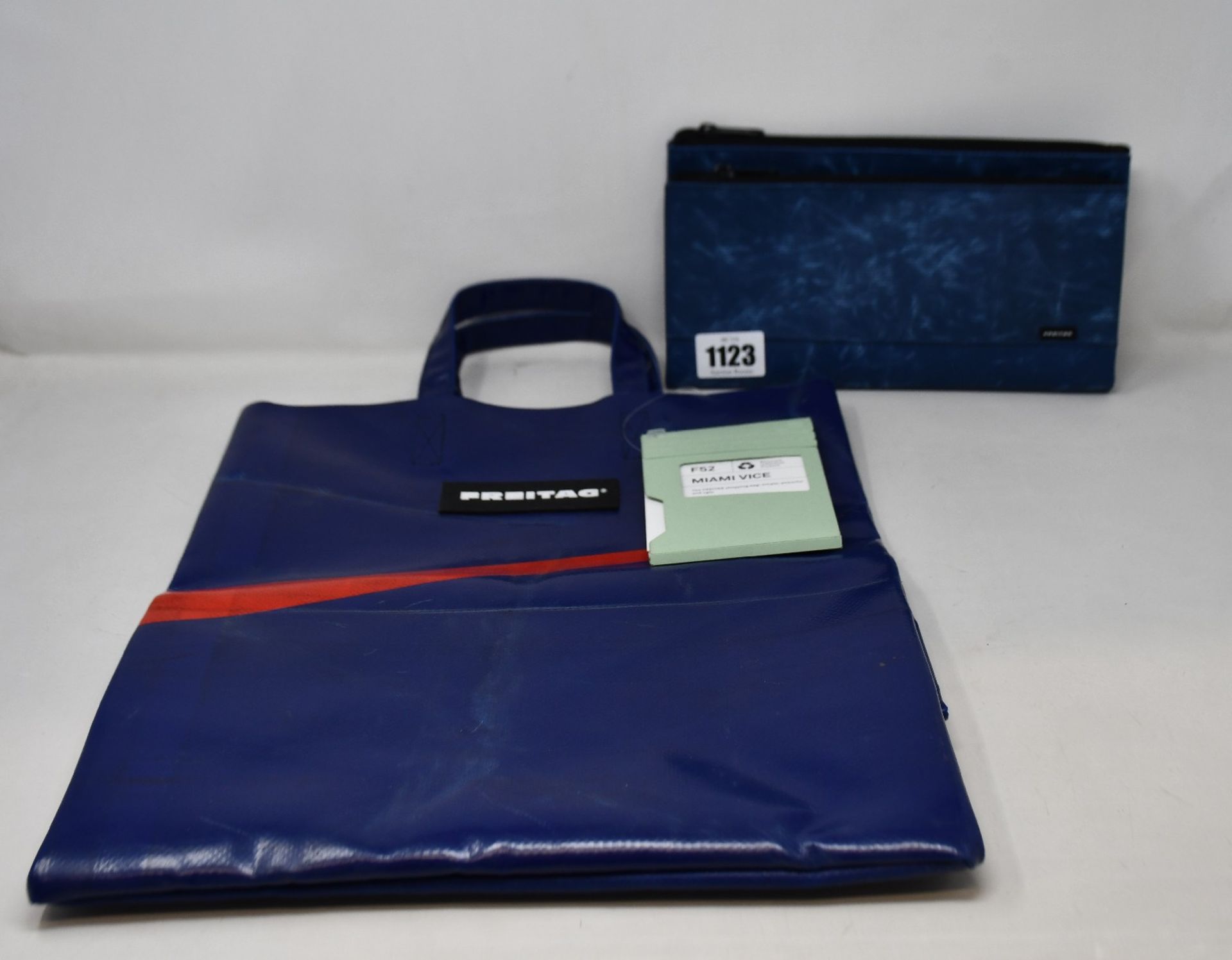 An as new Freitag F52 Miami Vice shopping bag (RRP £98) and a F271 Masikura pouch bag (RRP £80).