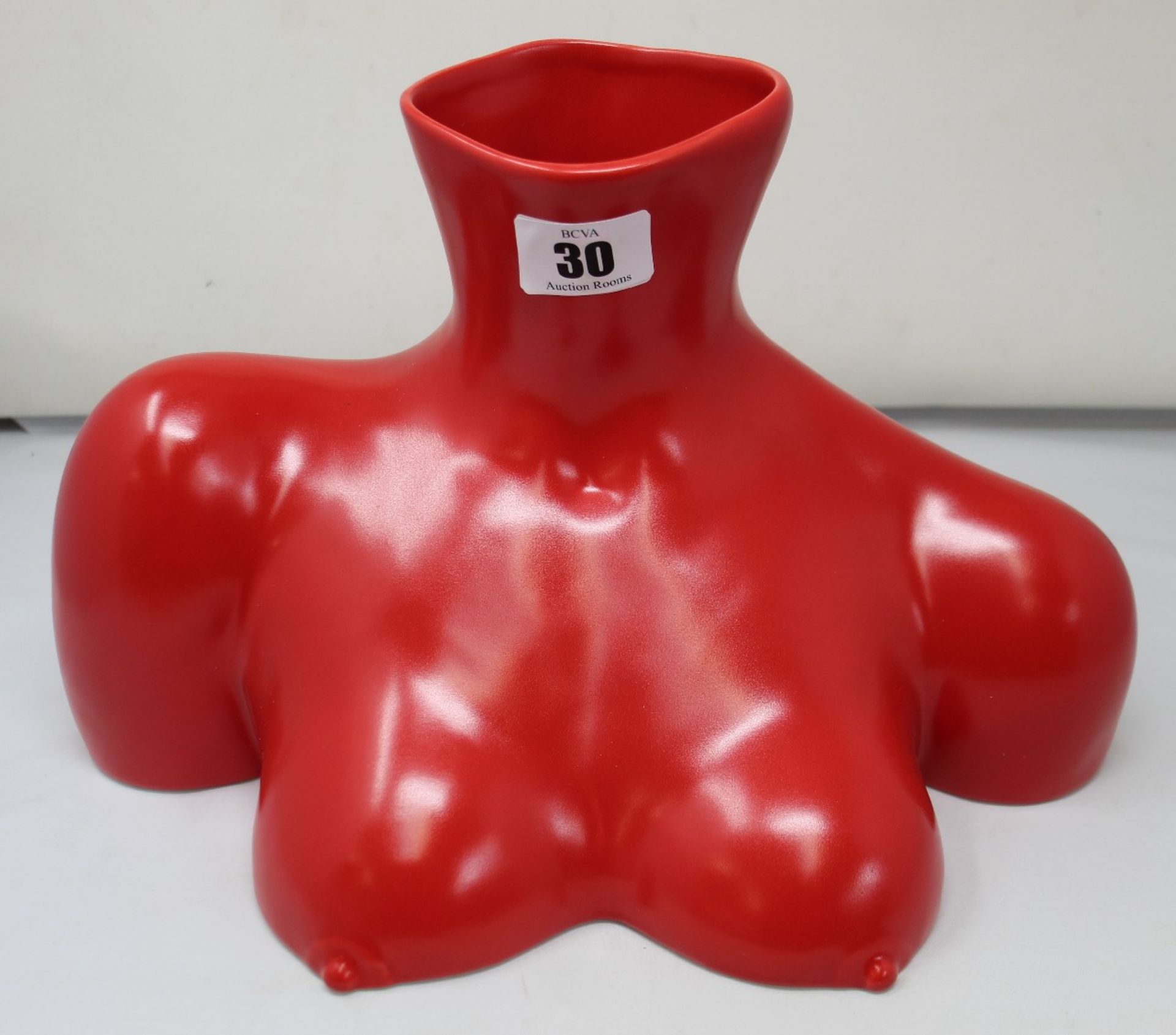 An Anissa Kermiche Breast Friend Vase in red.