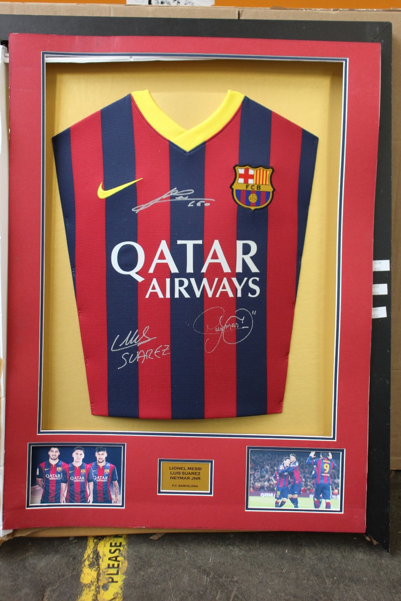 A pre-owned FC Barcelona football shirt - Signed by Messi, Neymar and Suarez (Item in a damaged