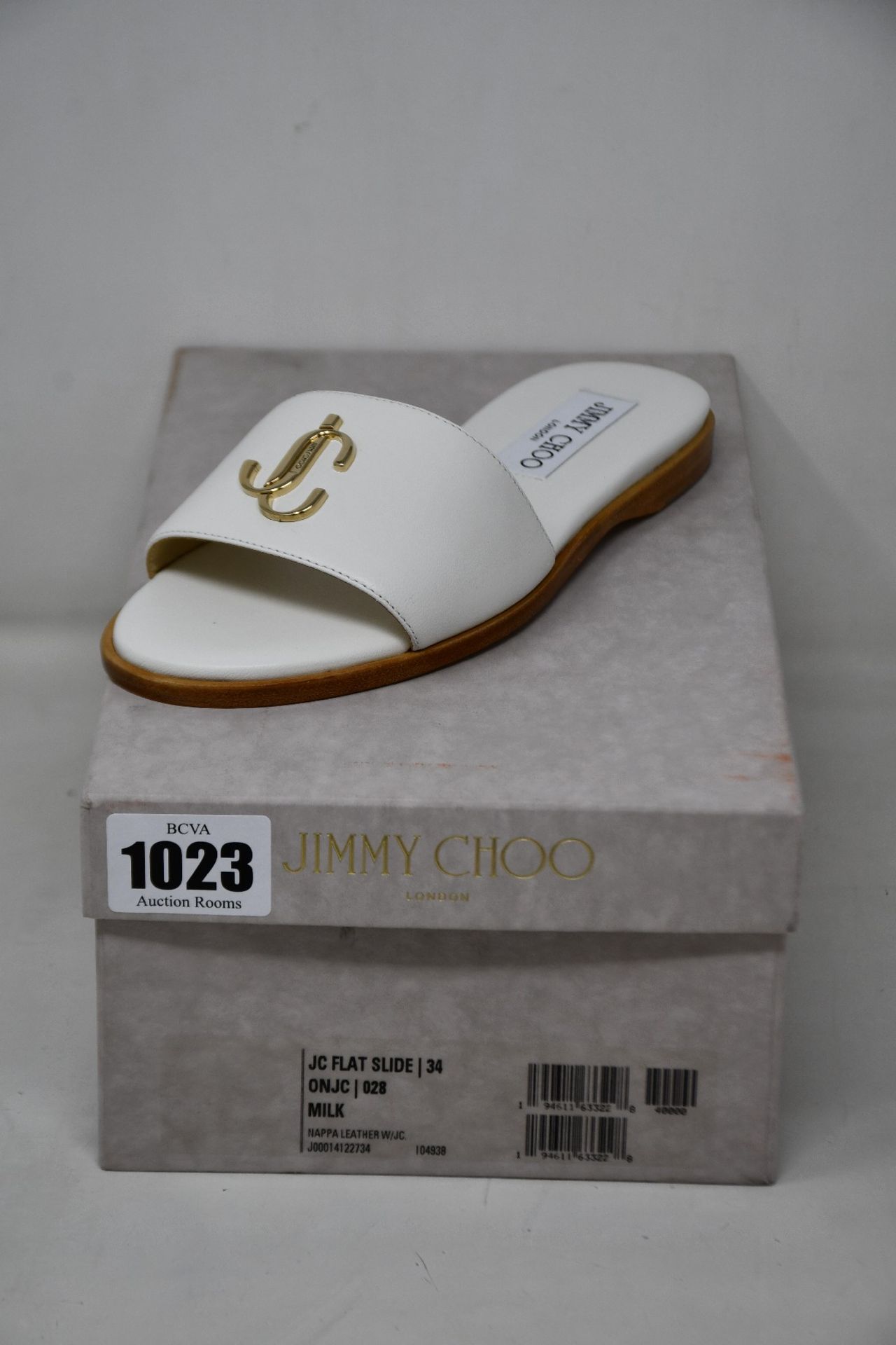 A pair of as new Jimmy Choo flat slide in milk (EU 34).