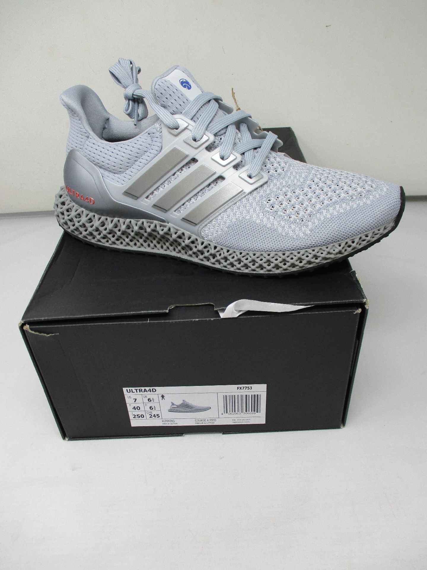 A pair of as new Adidas Ultra4D (UK 6.5).