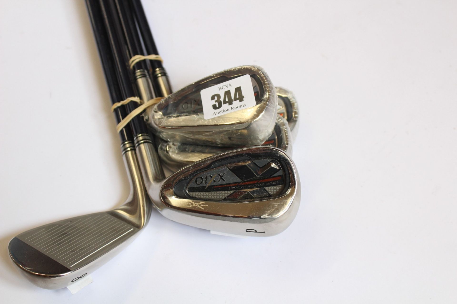 A set of XXIO True-Focus Impact irons 5,6,7,8,9 and P (Three clubs have some minor damage, other