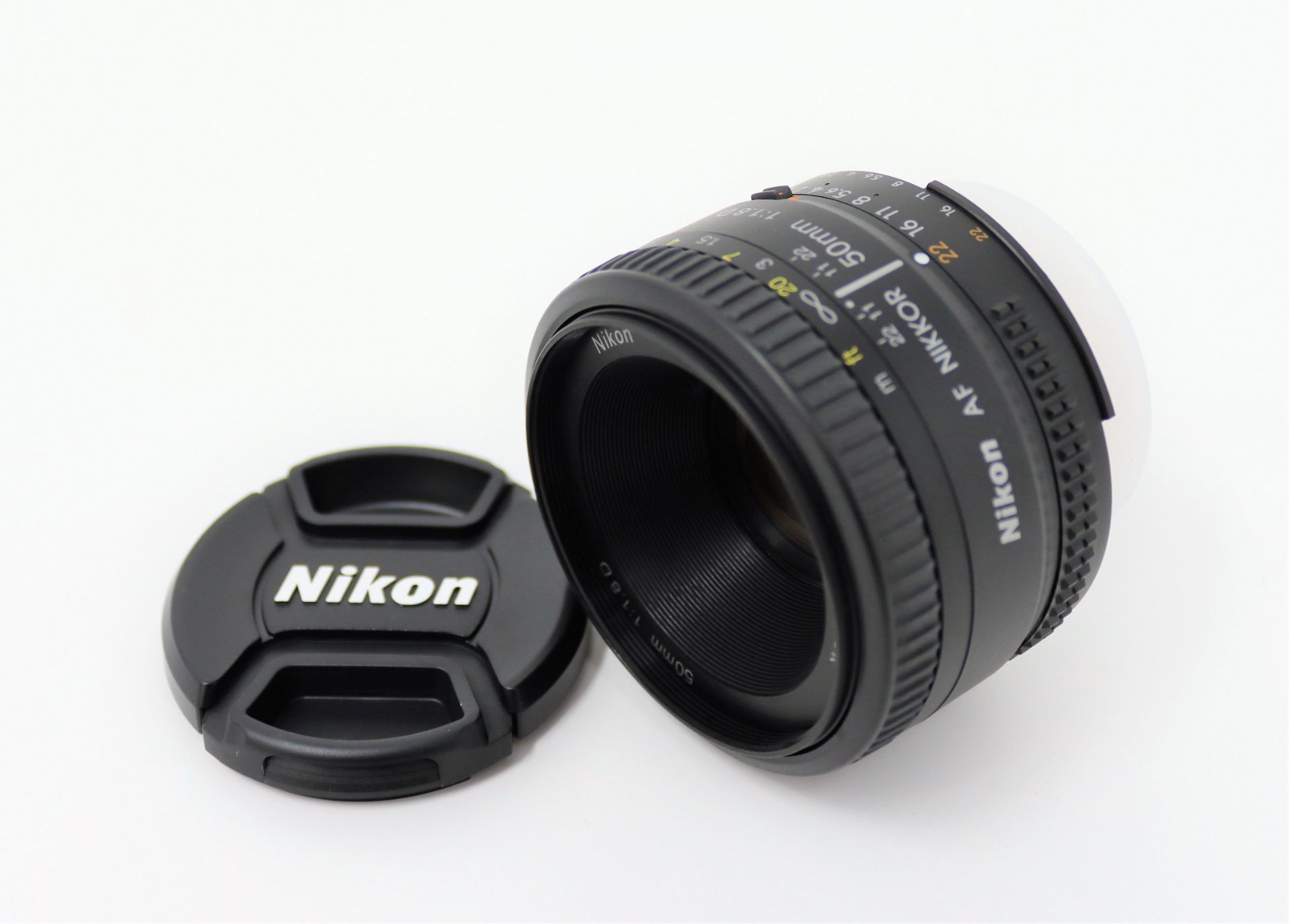 A boxed as new Nikon AF Nikkor 50mm f/1.8D Lens (Some damage to box).