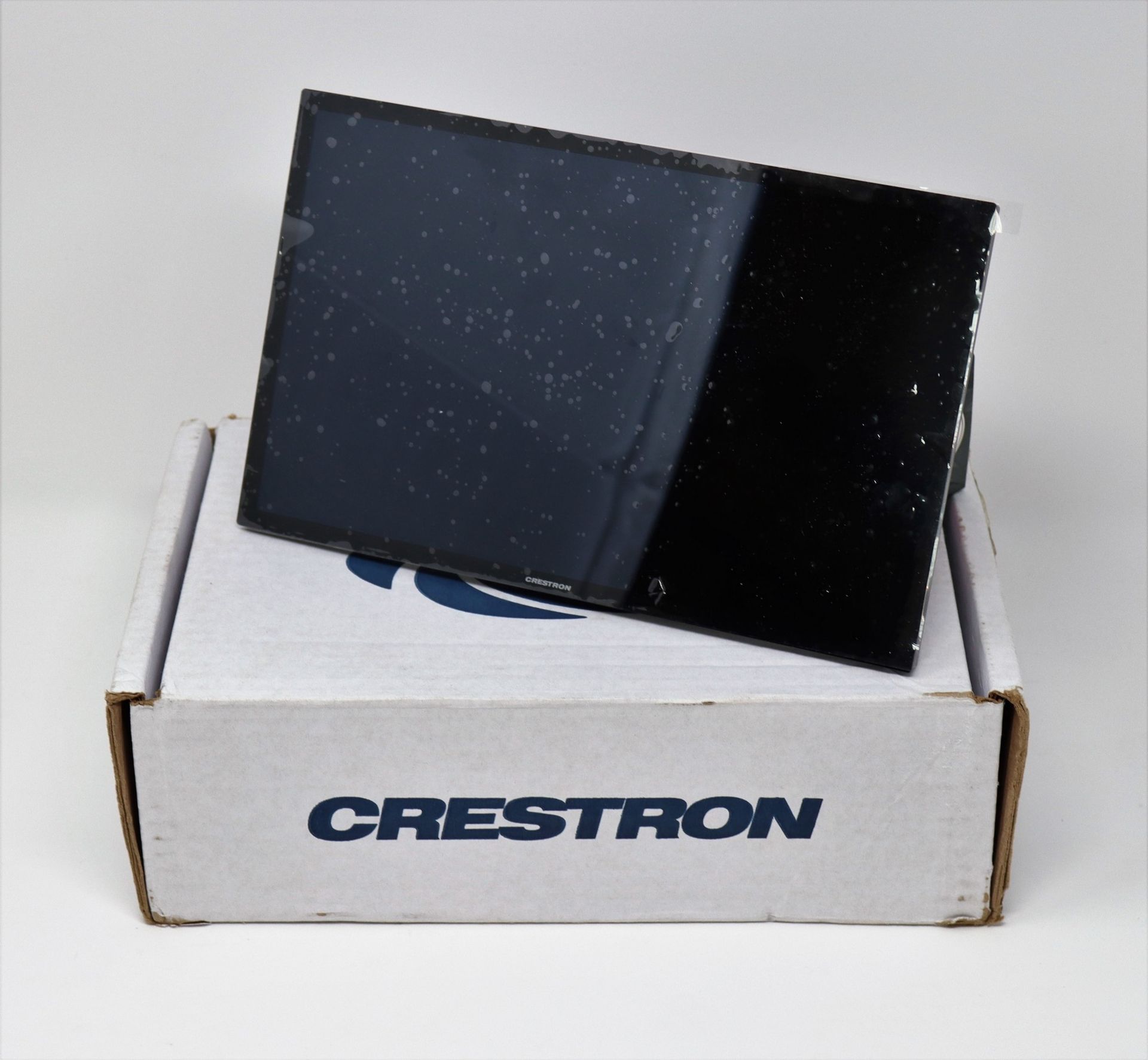 A boxed as new Crestron TSW-1070-B-S 10.1" Wall Mount Touch Screen in Black Smooth (M/N: M201923009)