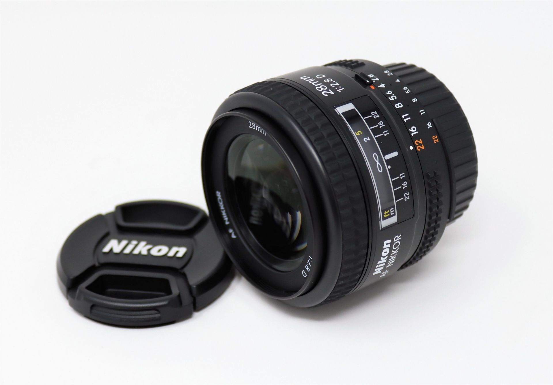 A boxed as new Nikon Nikkor AF 28mm f/2.8D Lens.