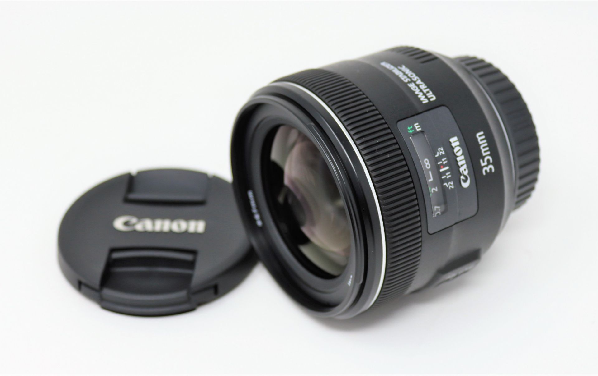 A boxed as new Canon EF 35mm f/2 IS USM Lens.