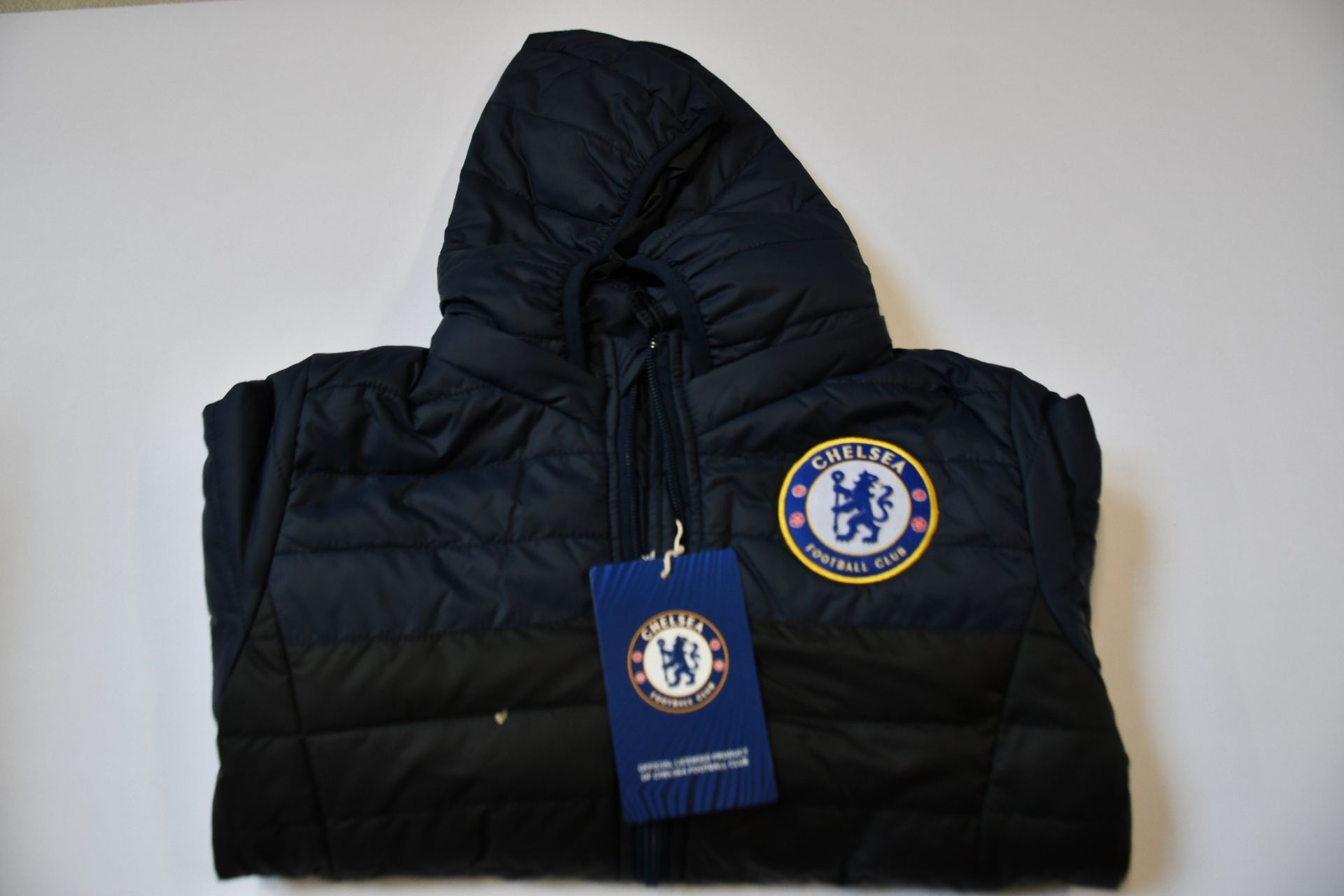 Four children's as new Official Chelsea F.C. padded coats (8-9 years - RRP £45 each).