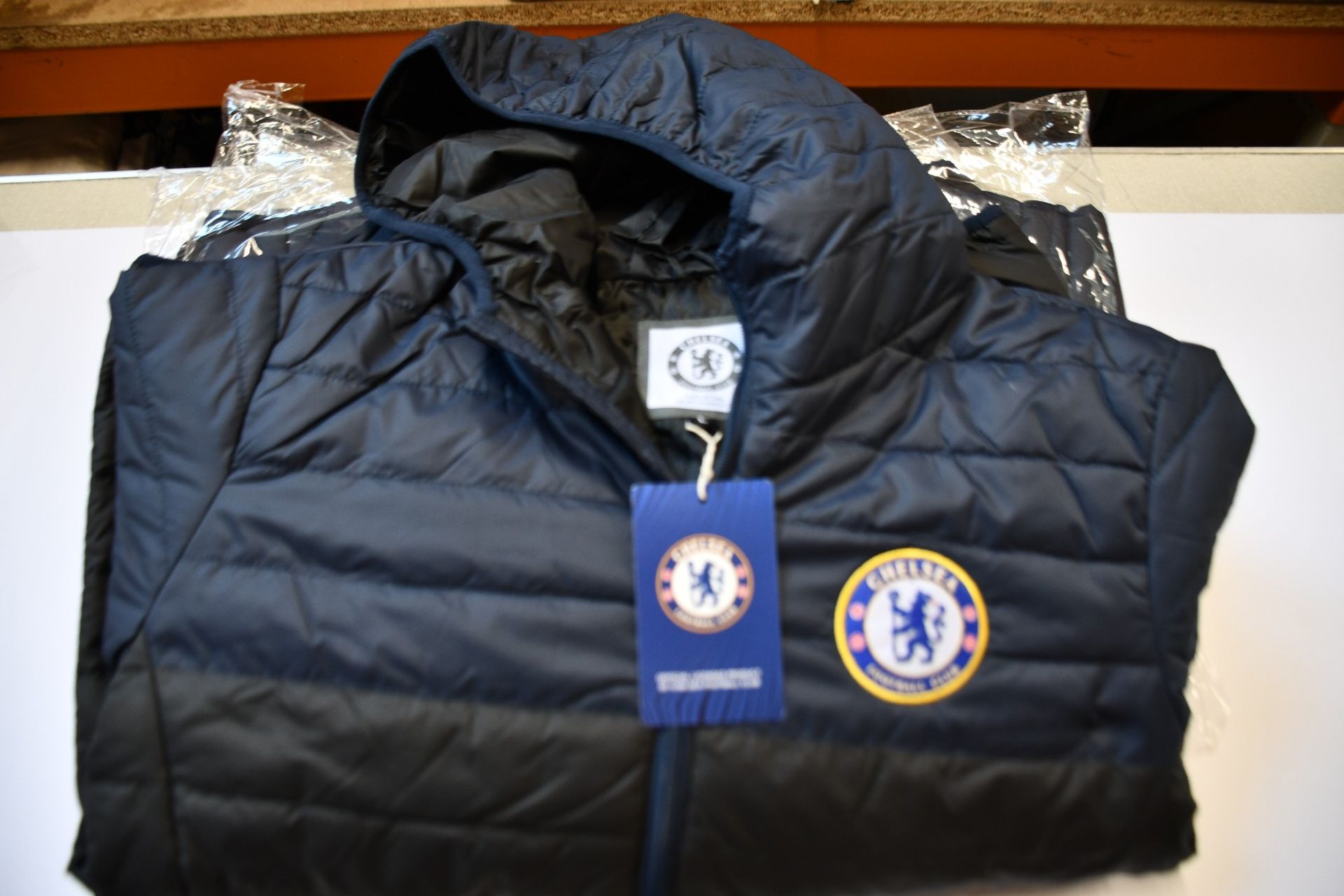 Four men's as new Official Chelsea F.C. padded jackets (L - RRP £60 each).