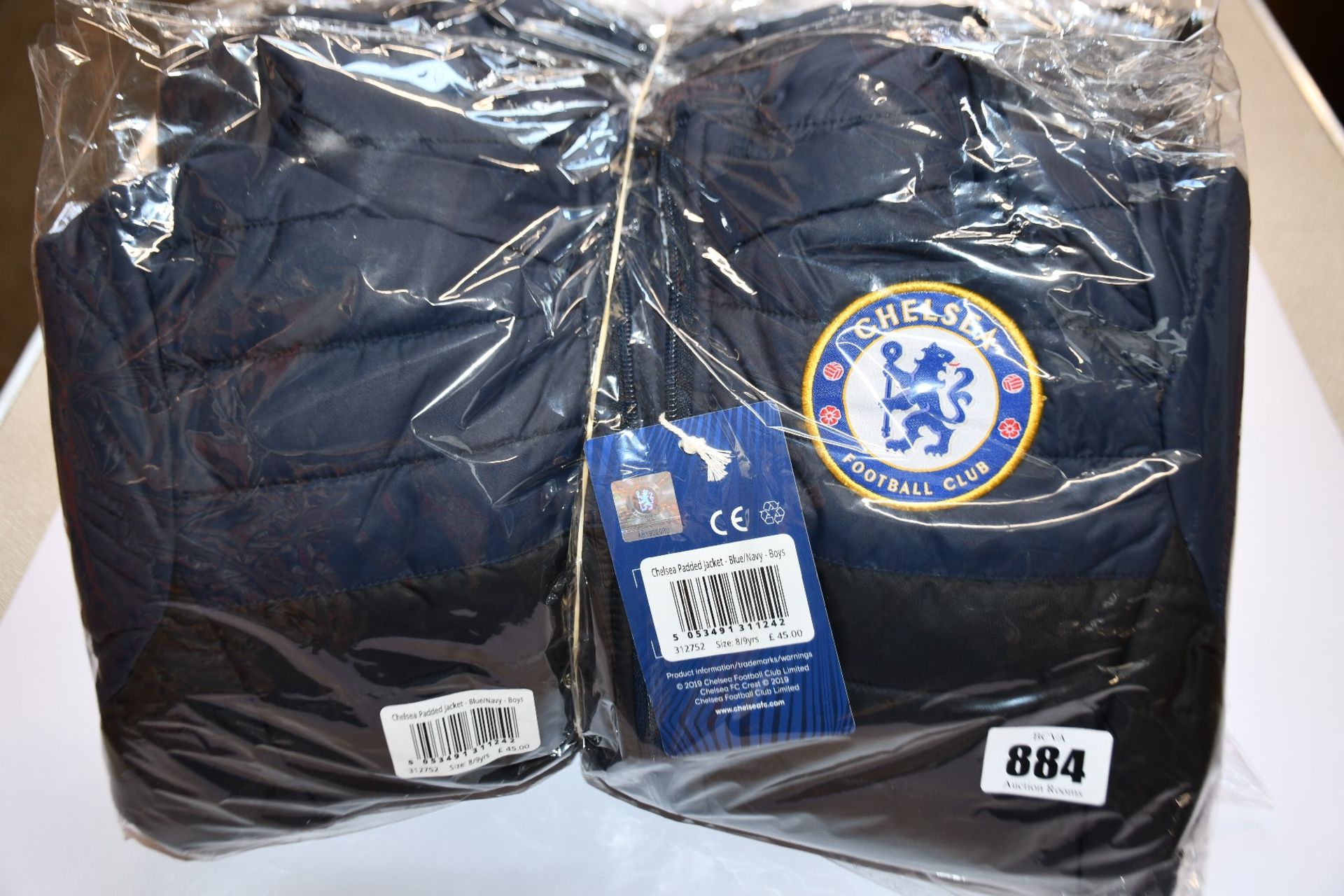 Four children's as new Official Chelsea F.C. padded coats (8-9 years - RRP £45 each).