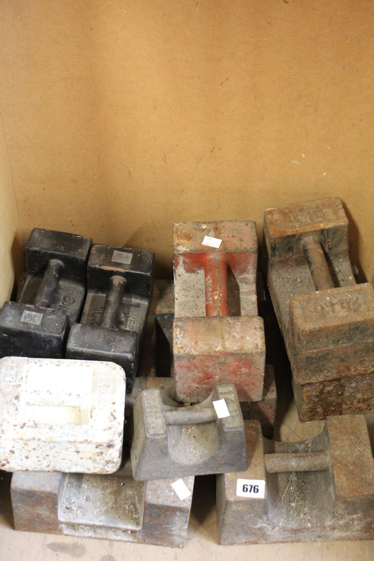 Twelve pre-owned weight blocks (Various sizes).