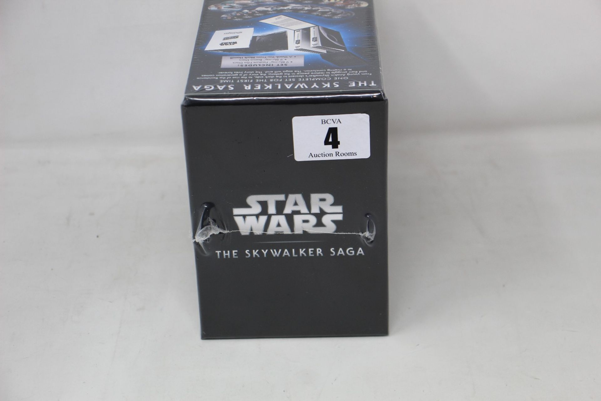 Three boxed as new Star Wars: The Skywalker Saga 9-movie blu-ray collection boxes.