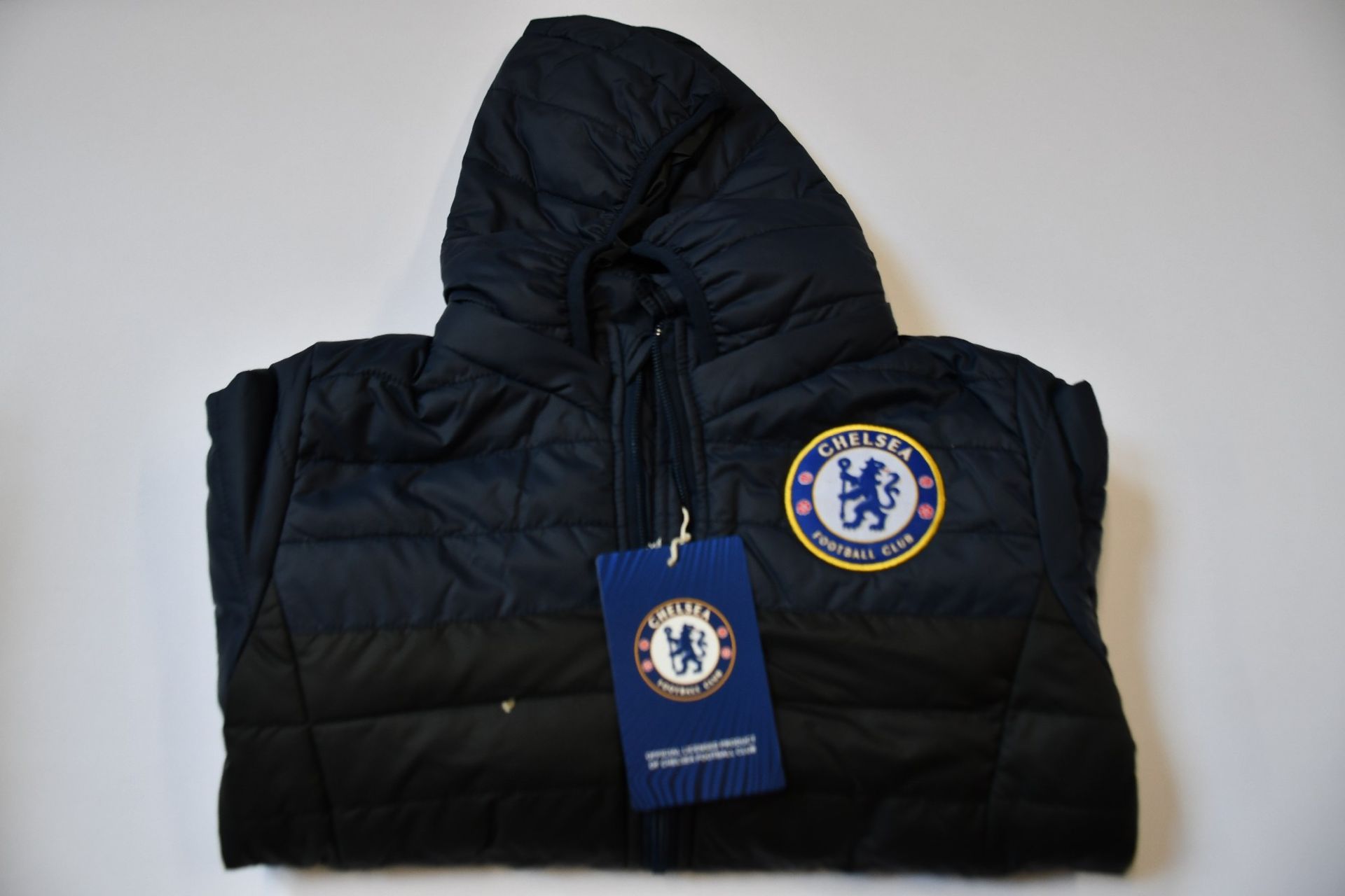 Four children's as new Official Chelsea F.C. padded coats (8-9 years - RRP £45 each).