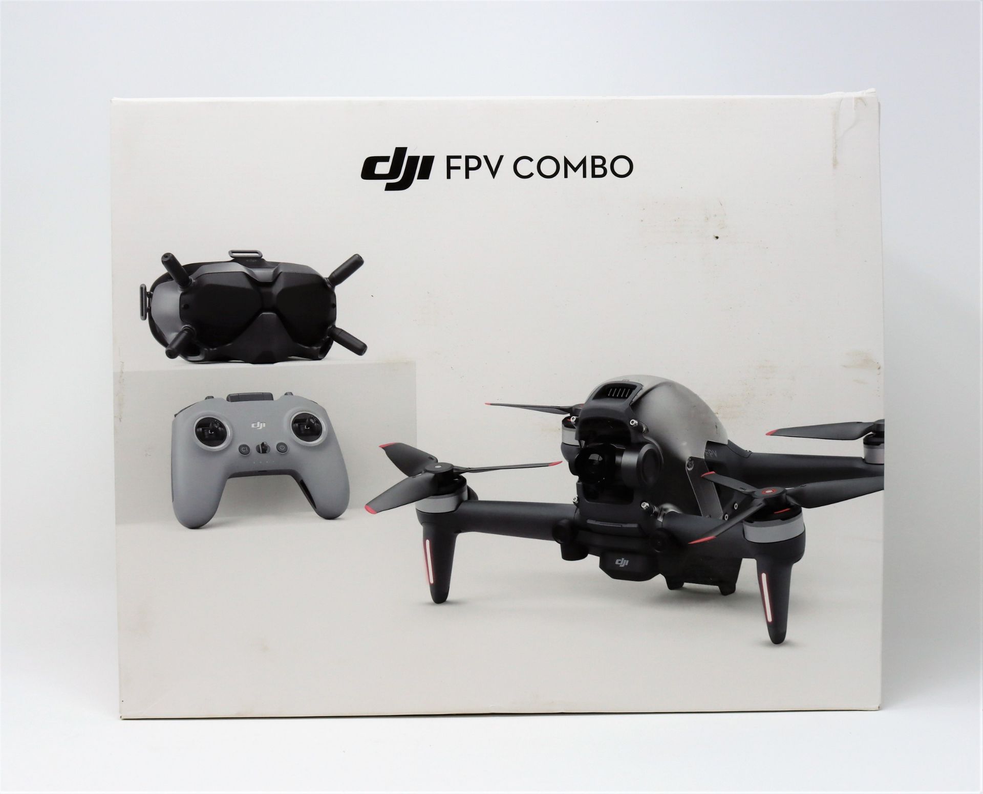 A pre-owned DJI FPV Quadcopter Drone in Black with Goggles V2, Goggles Antenna, Controller,