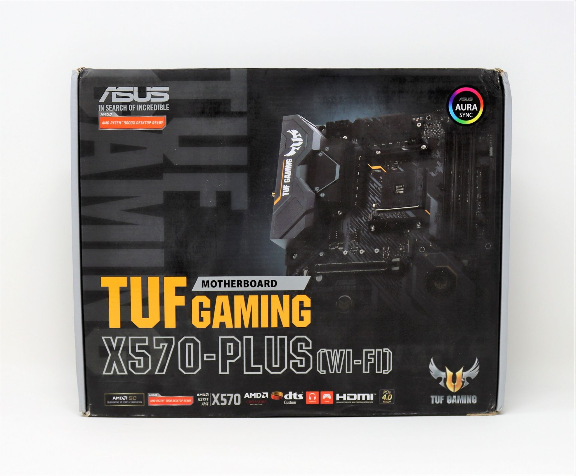 A pre-owned boxed Asus TUF gaming X570-PLUS Wi-Fi motherboard for AMD processors (untested).