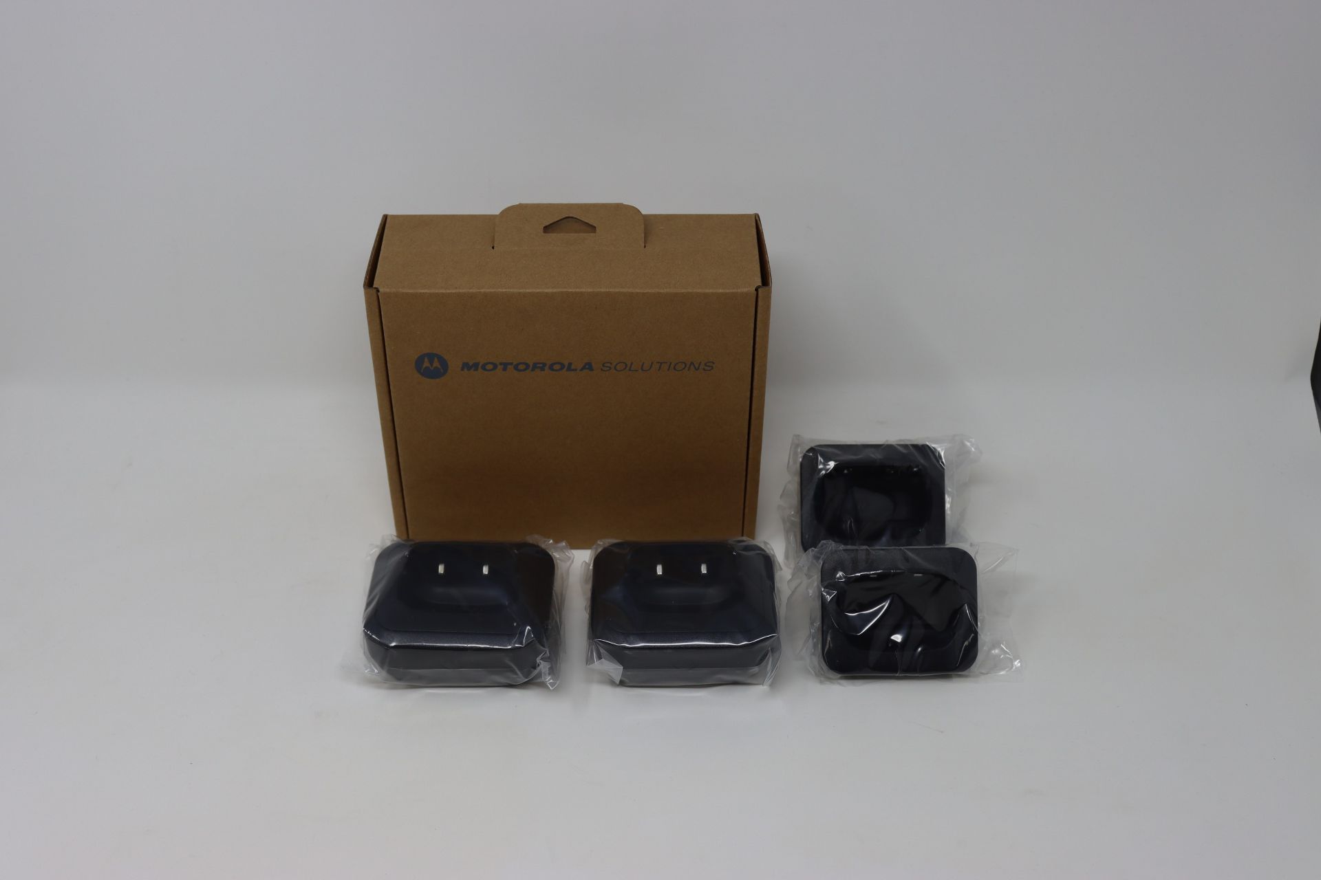 Five boxes of six boxed as new Motorola Talkabout Single Charger Tray Twin Packs (M/N: