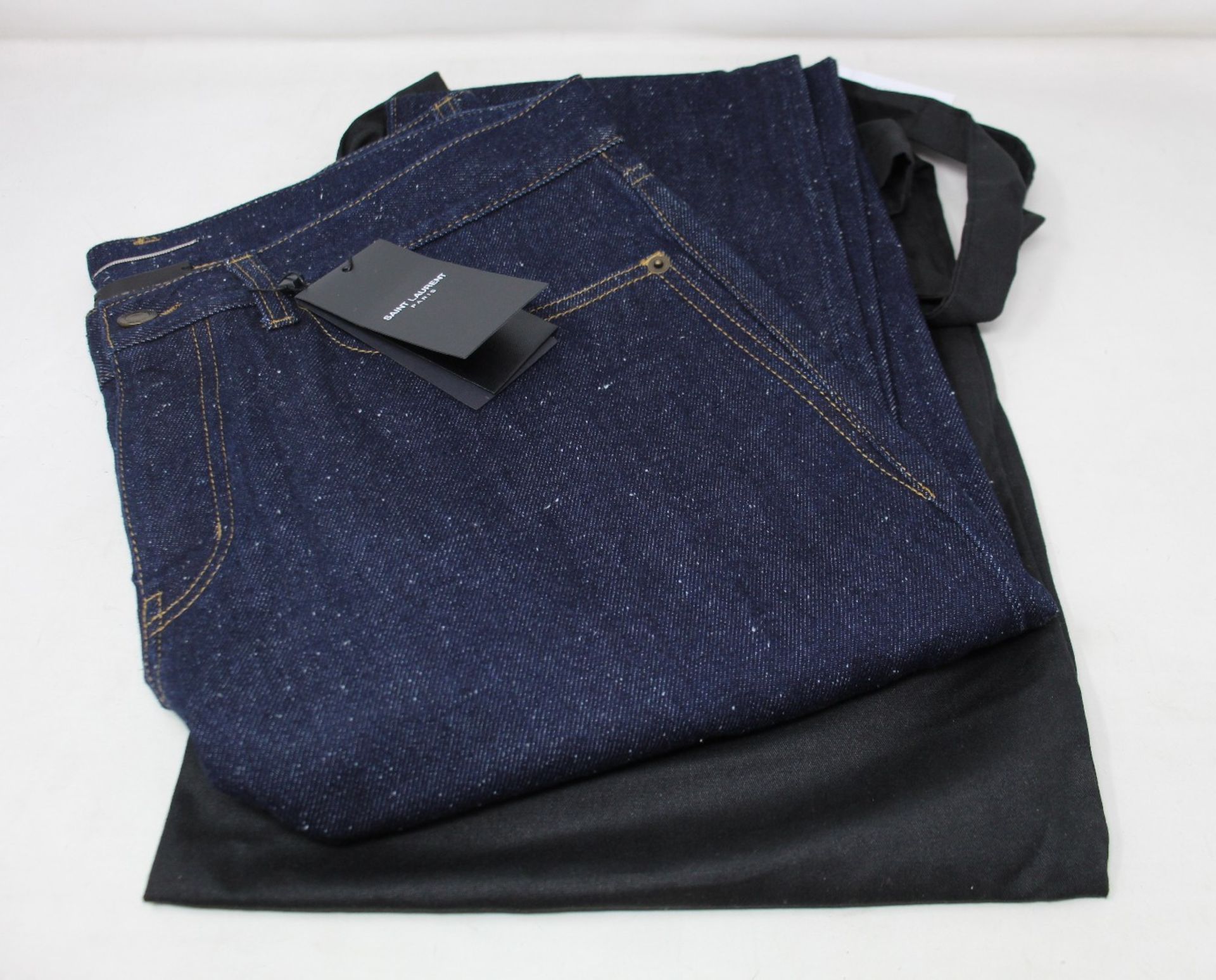 A pair of as new Saint Laurent 00106 skinny fit dark blue jeans (Size 33).