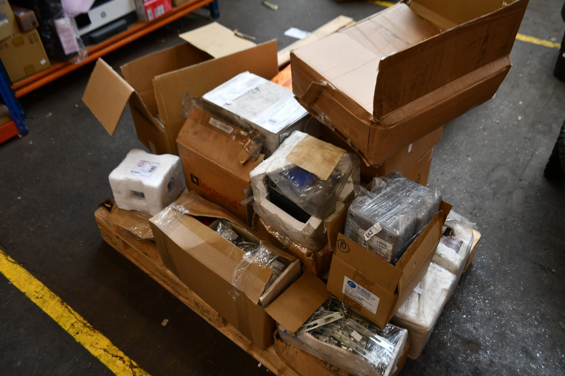 A pallet of assorted Legrand tools and equipment to include shelving brackets, fused connection