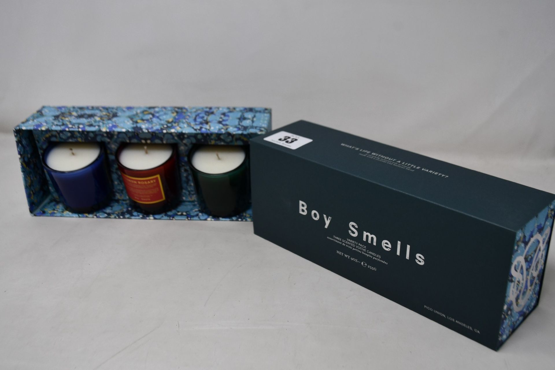 Four trio sets of Boy Smells holiday scented votive candles.