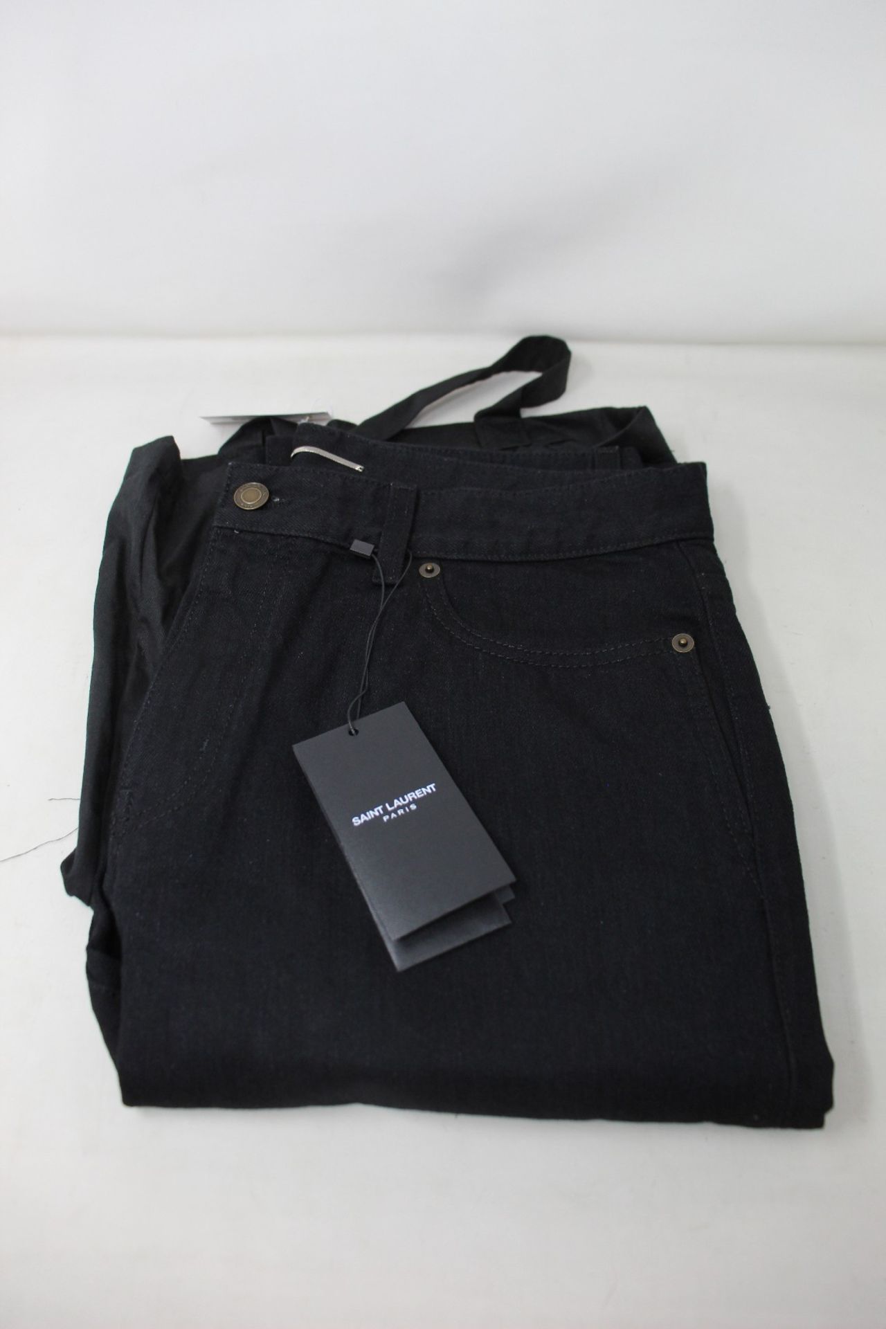 A pair of as new Saint Laurent 00859 skinny fit black jeans (Size 33).